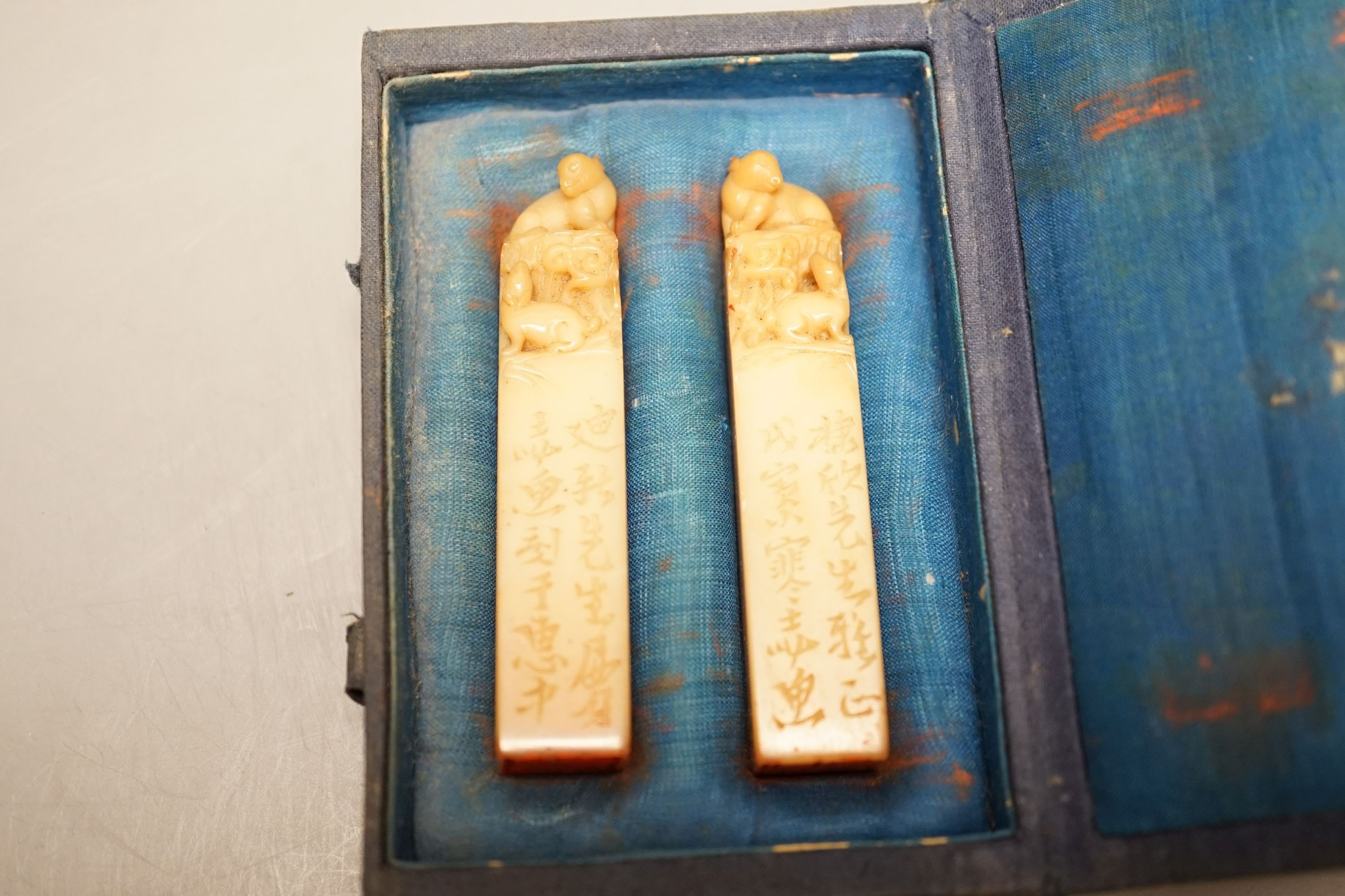 A group of seals including two boxed Chinese soapstone seals